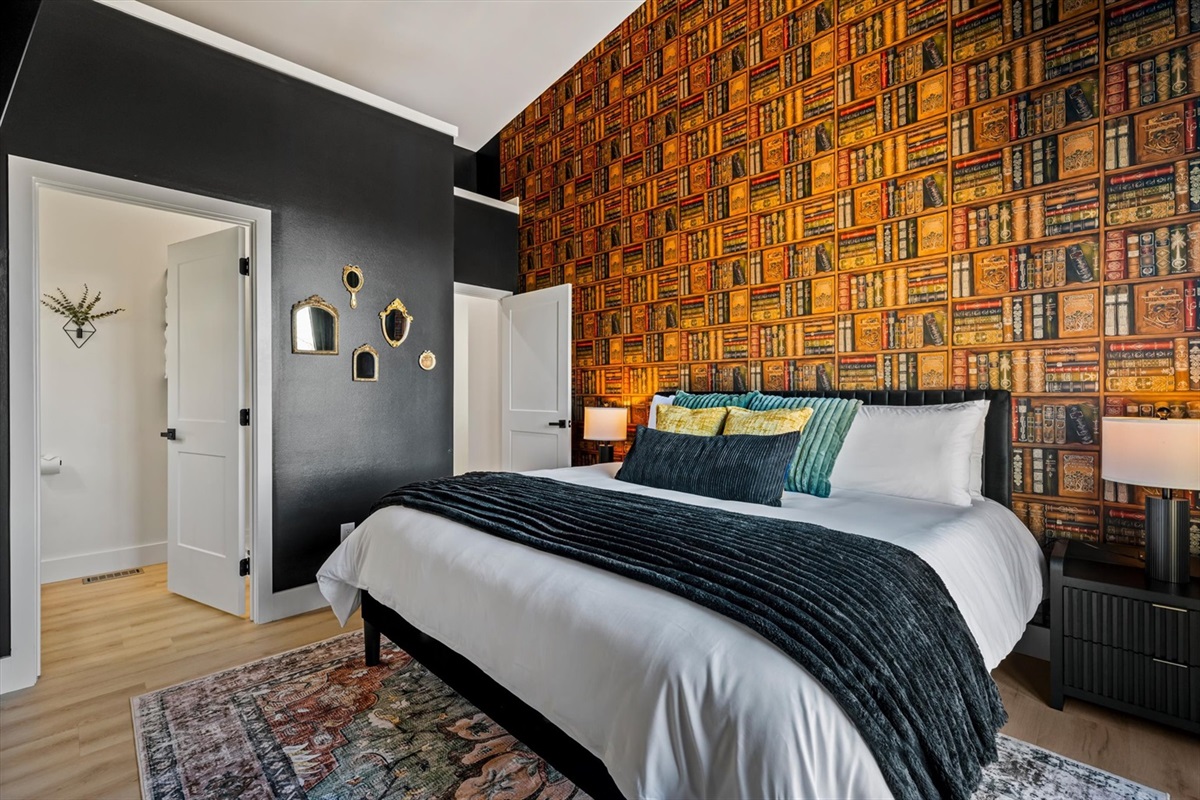 {King Bedroom}
A dark academia-inspired retreat — a king bedroom with 65 in Roku TV and a space that feels like your own private library to unwind in.