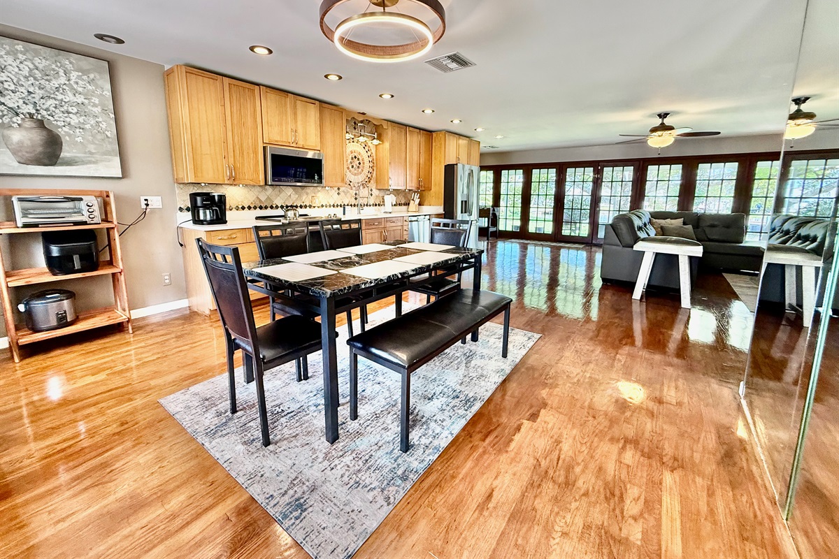The large dining table comfortably seats six and sits just steps away from the kitchen—so no one misses a moment of the conversation, even while cooking.