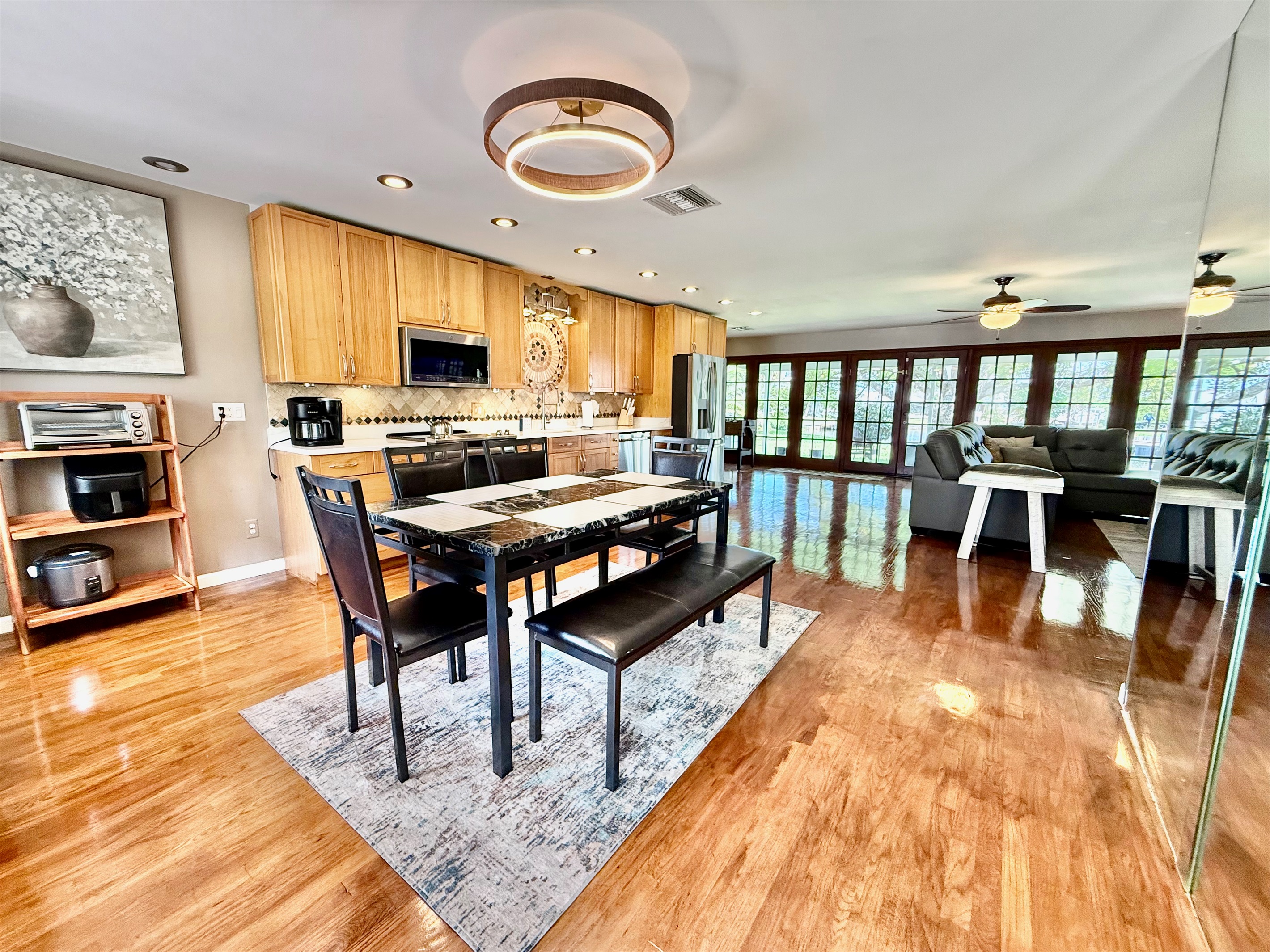 The large dining table comfortably seats six and sits just steps away from the kitchen—so no one misses a moment of the conversation, even while cooking.
