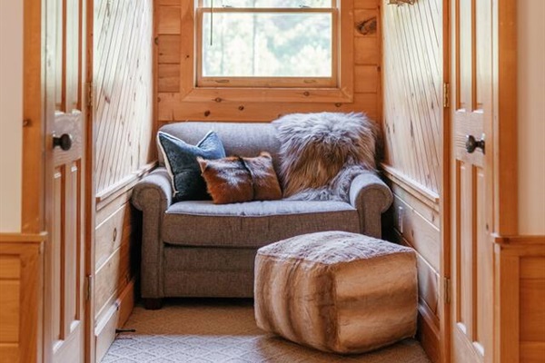 Cozy reading nook in bedroom. 