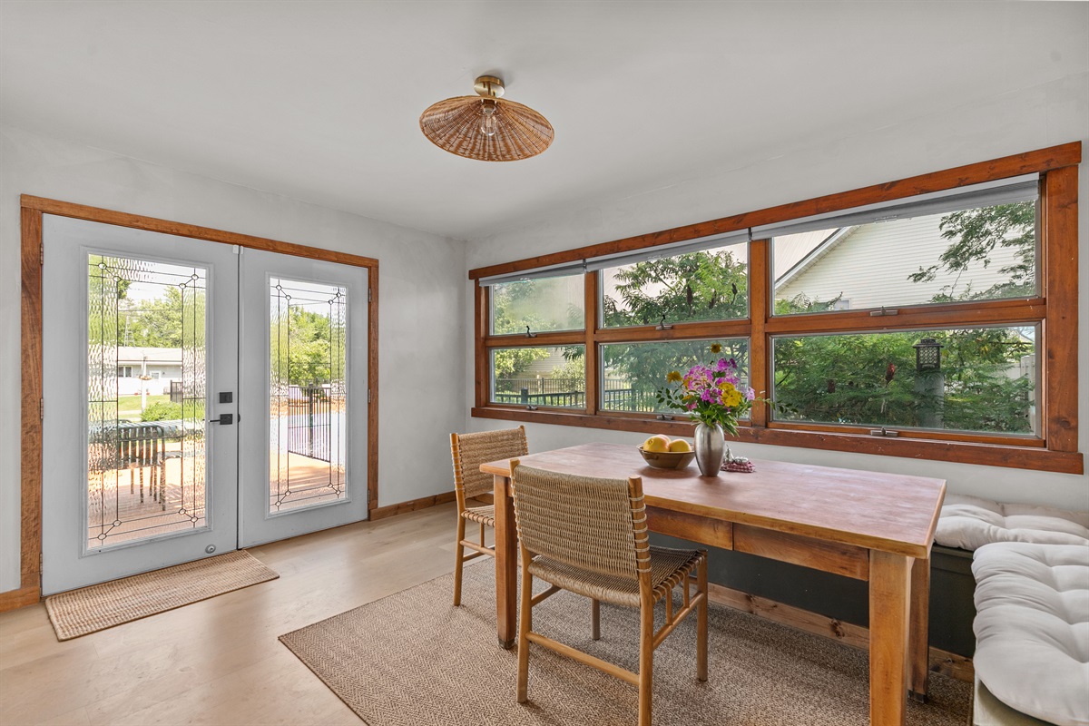 Bright breakfast nook with sunlight and backyard views — the perfect start to your day.