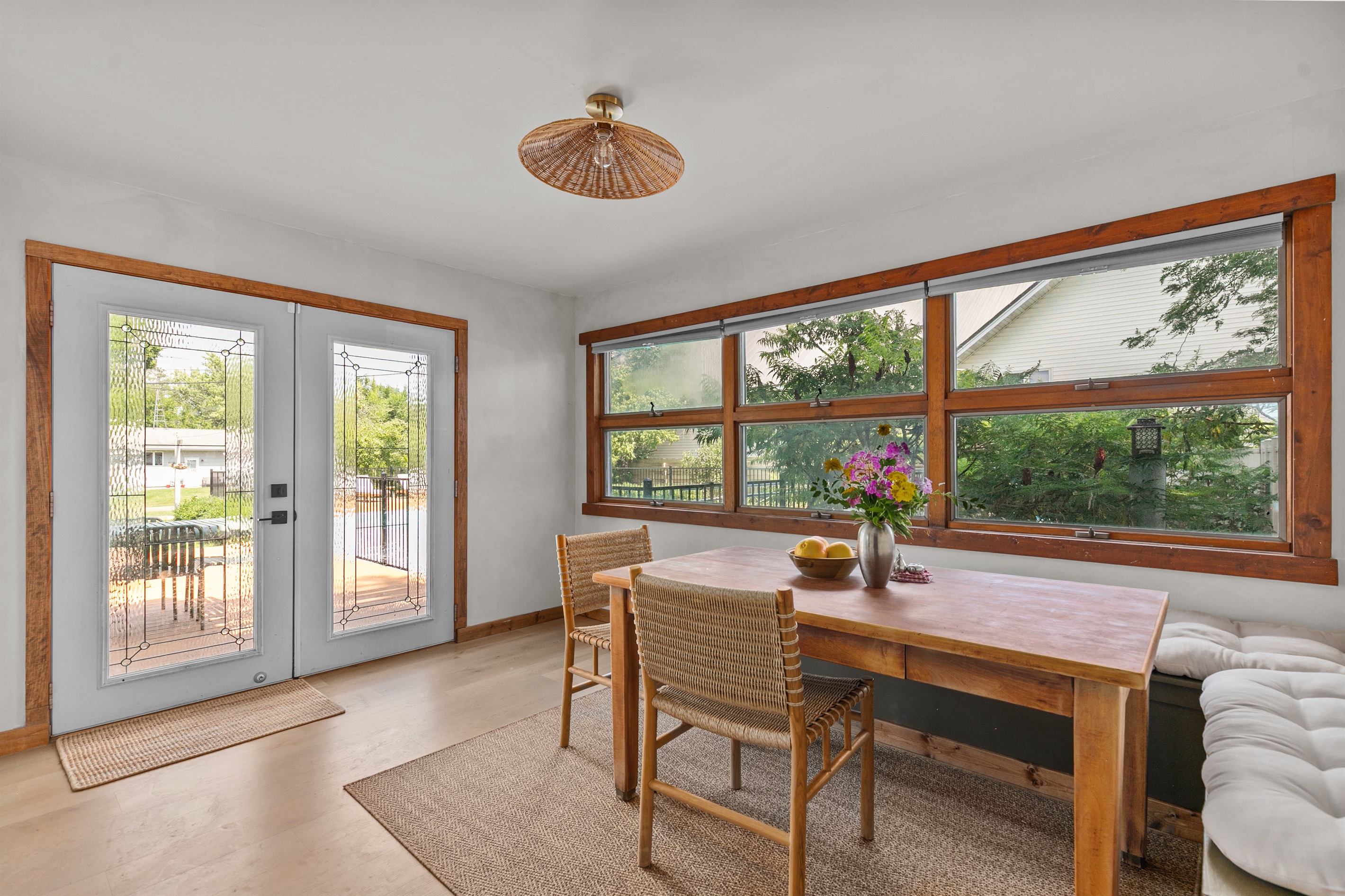 Bright breakfast nook with sunlight and backyard views — the perfect start to your day.