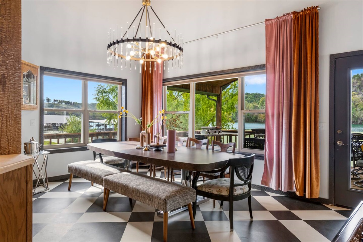 Elegant dining for 12-14 people with lake view.  Baby booster chair provided.