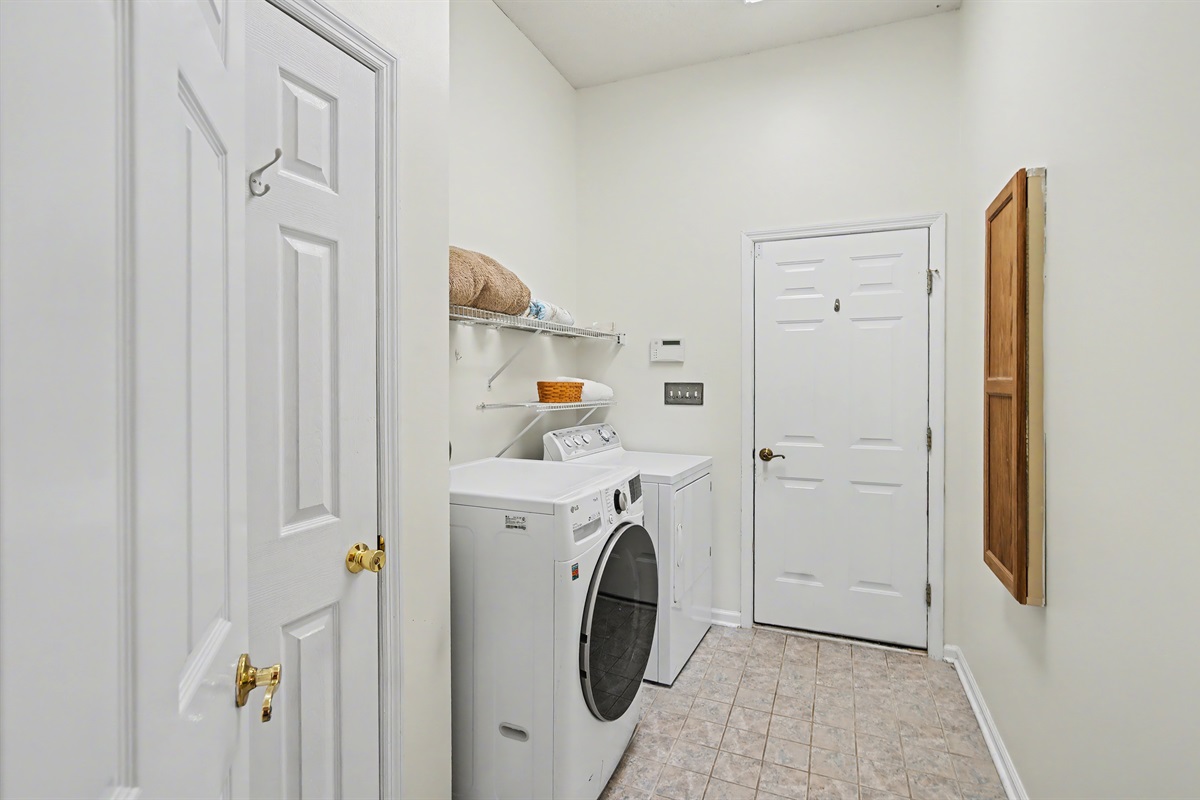 Full size wash and dryer in laundry room
