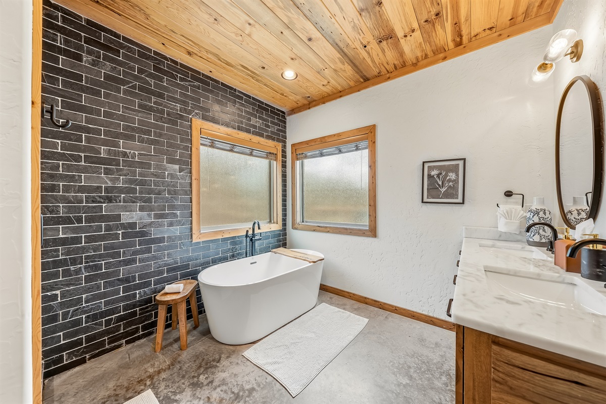 Relax in a spa-like bath with a soaking tub and upscale finishes.