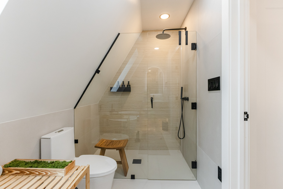 Walk-in shower under a skylight