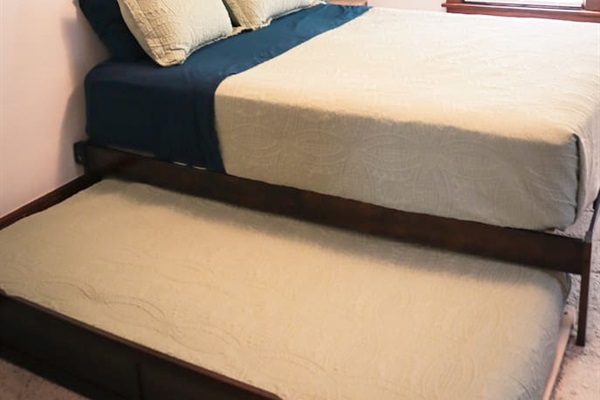 Twin trundle bed.  Additional pillows in dresser