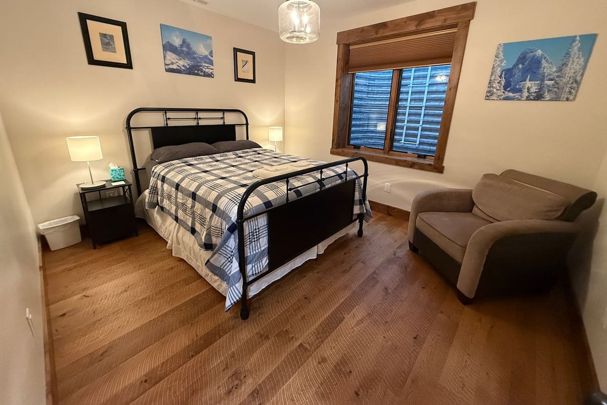 basement bedroom with queen bed
