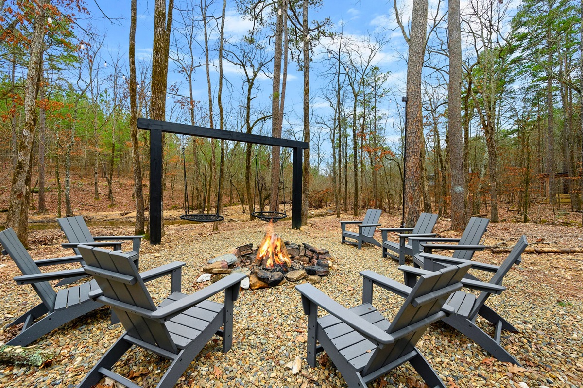 This outdoor hangout area features a big fire pit surrounded by Adirondack chairs, perfect for s’mores and late-night stories.