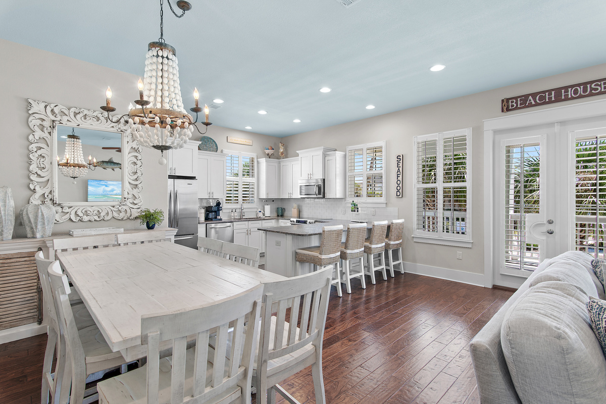 Gather around the spacious dining table and fully equipped kitchen, perfect for relaxed meals and memorable evenings.