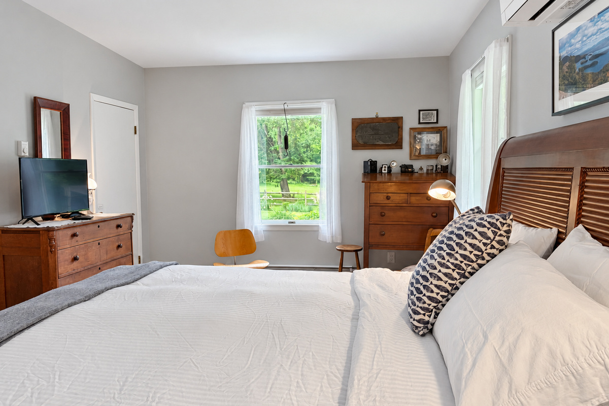 King bedroom with TV.