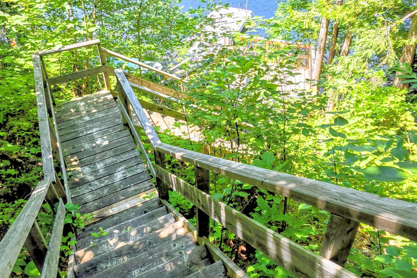 Stairs down hillside to lower deck and dock