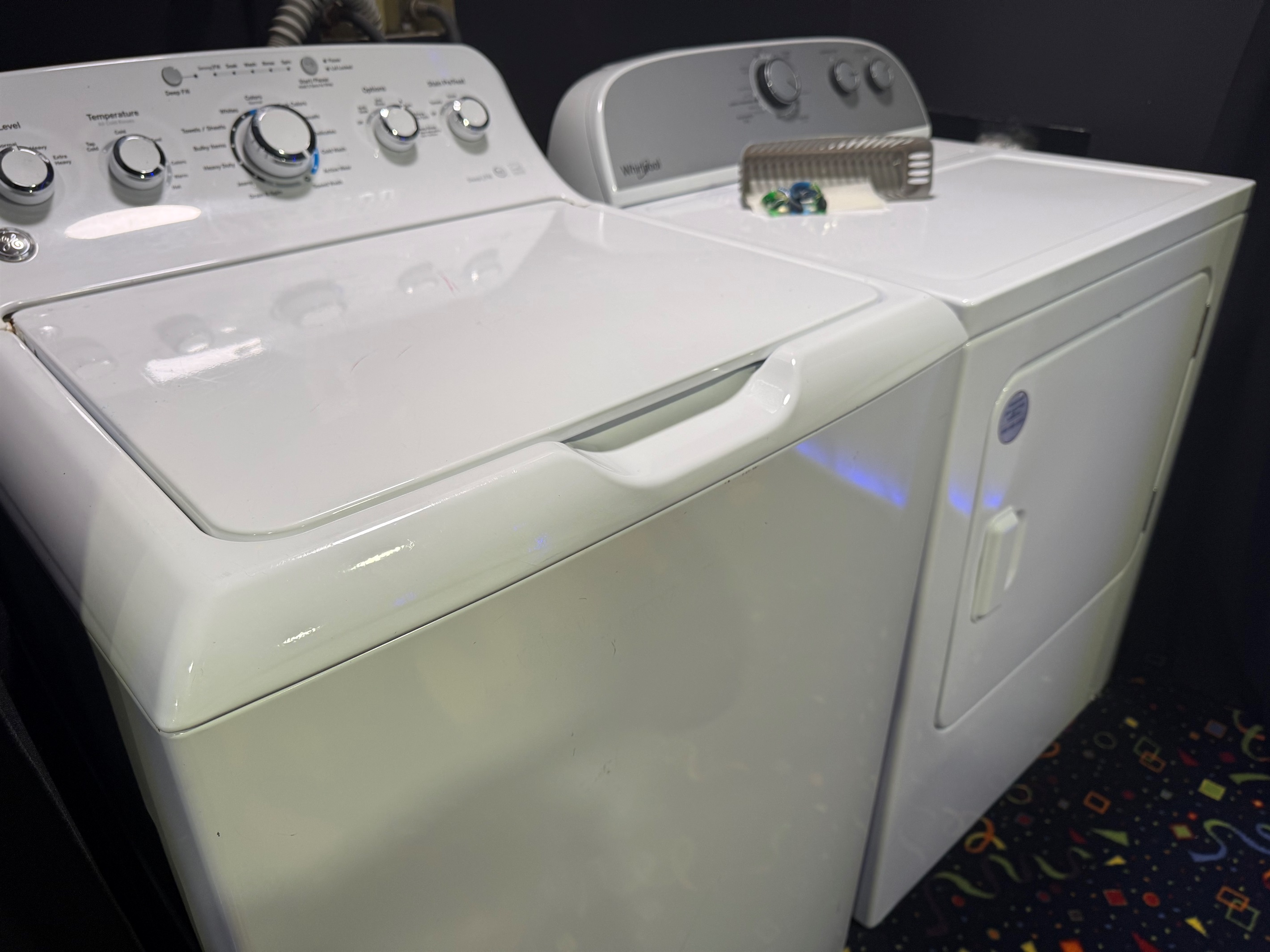 Laundry area with large capacity washer, dryer, detergent pods and dryer sheets 