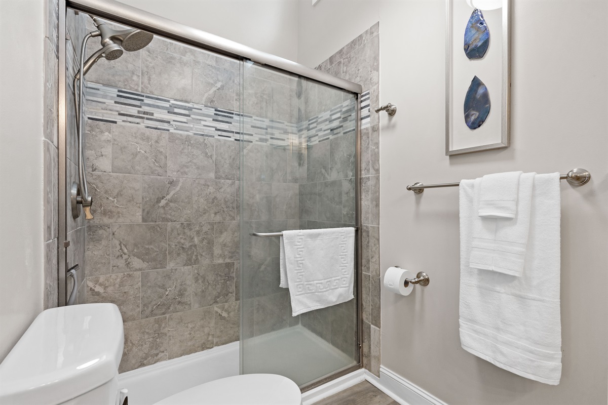 1st floor bathroom with glass walk-in shower and modern finishes