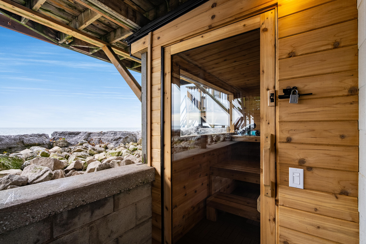 Private outdoor sauna nestled beside the water’s edge.