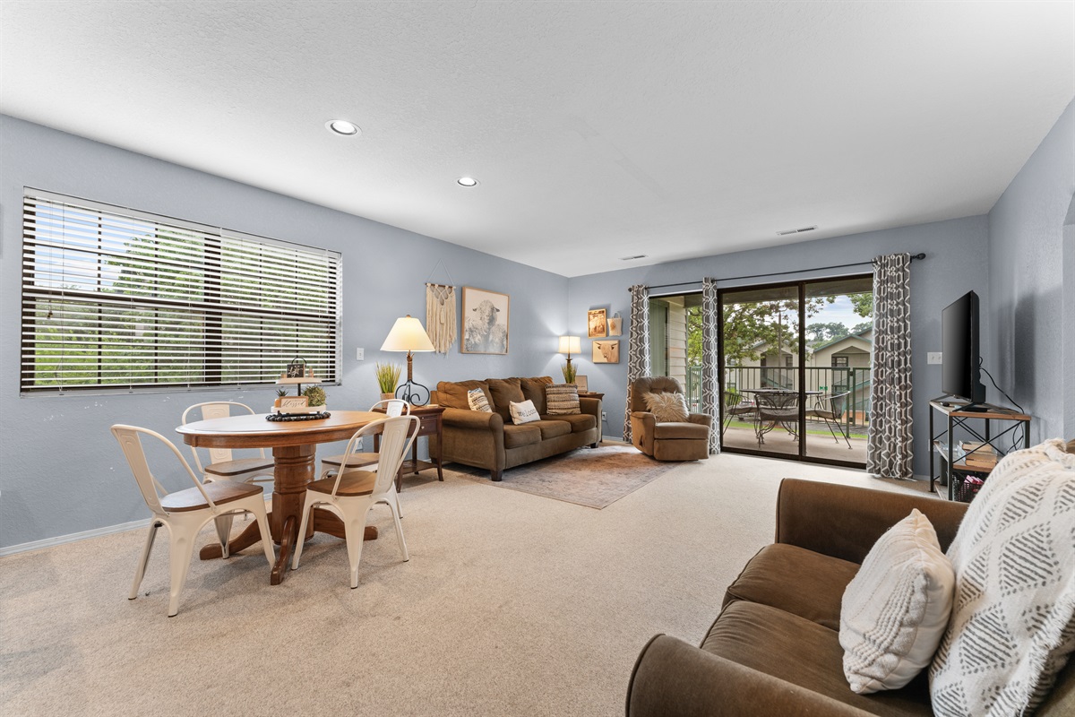 Stretch out after a day in Branson with an open living area, dining space, and easy patio access.