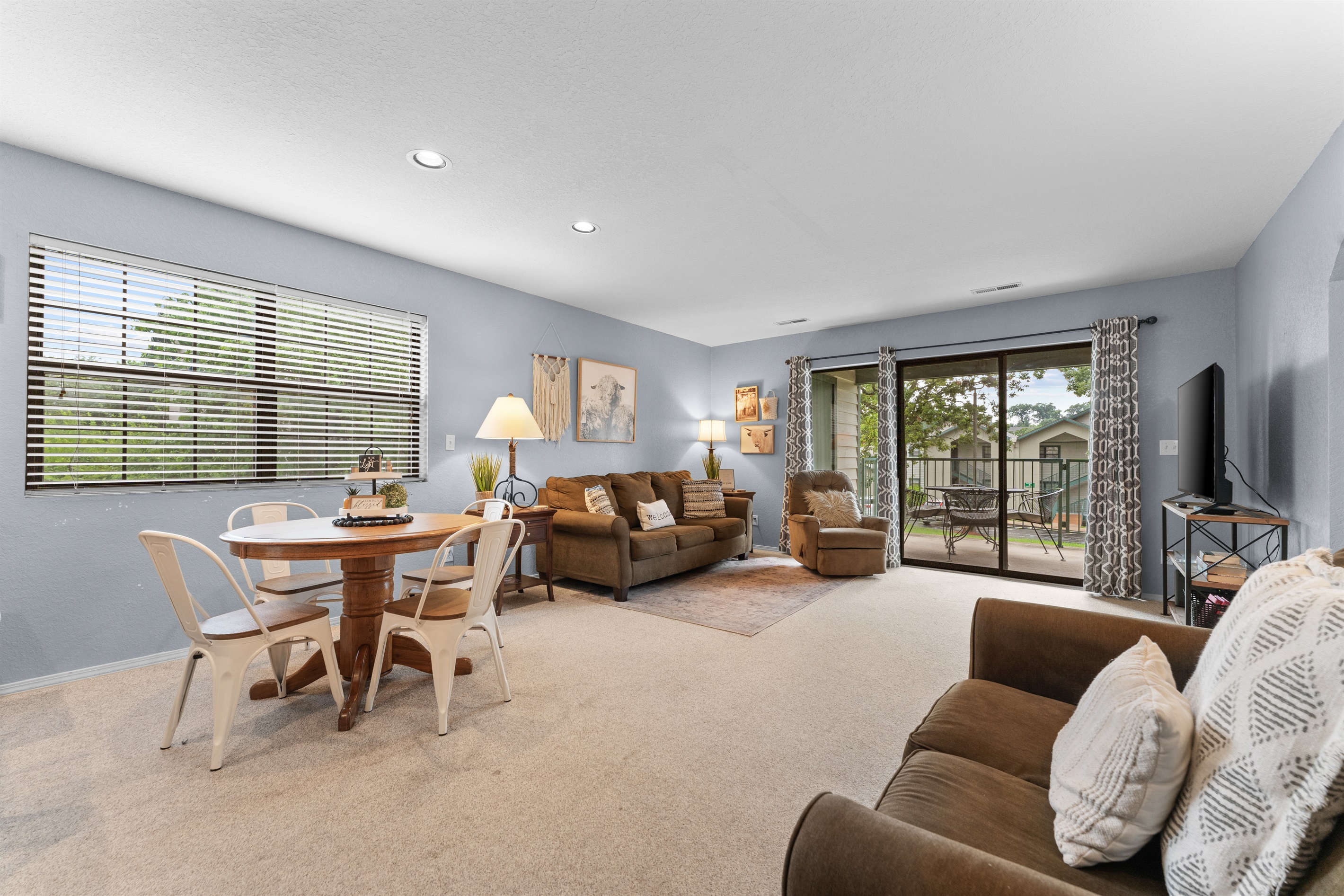 Stretch out after a day in Branson with an open living area, dining space, and easy patio access.