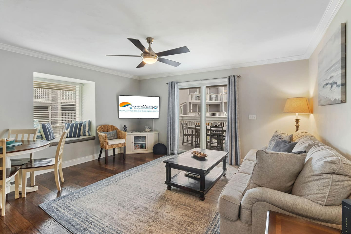 You can watch the Gulf change color all day from this couch. The Smart TV is for when the kids need a break from the sun &mdash; everyone gets what they came for.