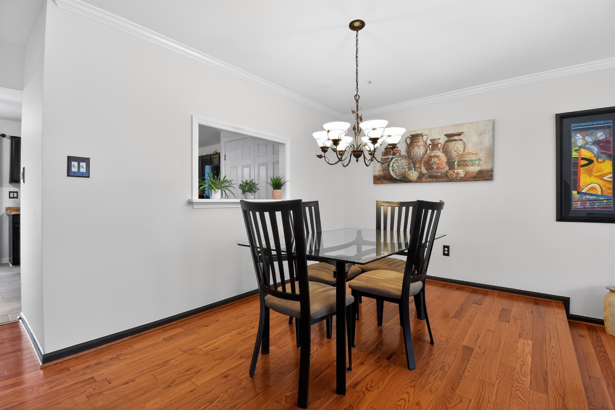 Dining Area — Four-Person Table, Hardwood Floors, Open to Main Living Room