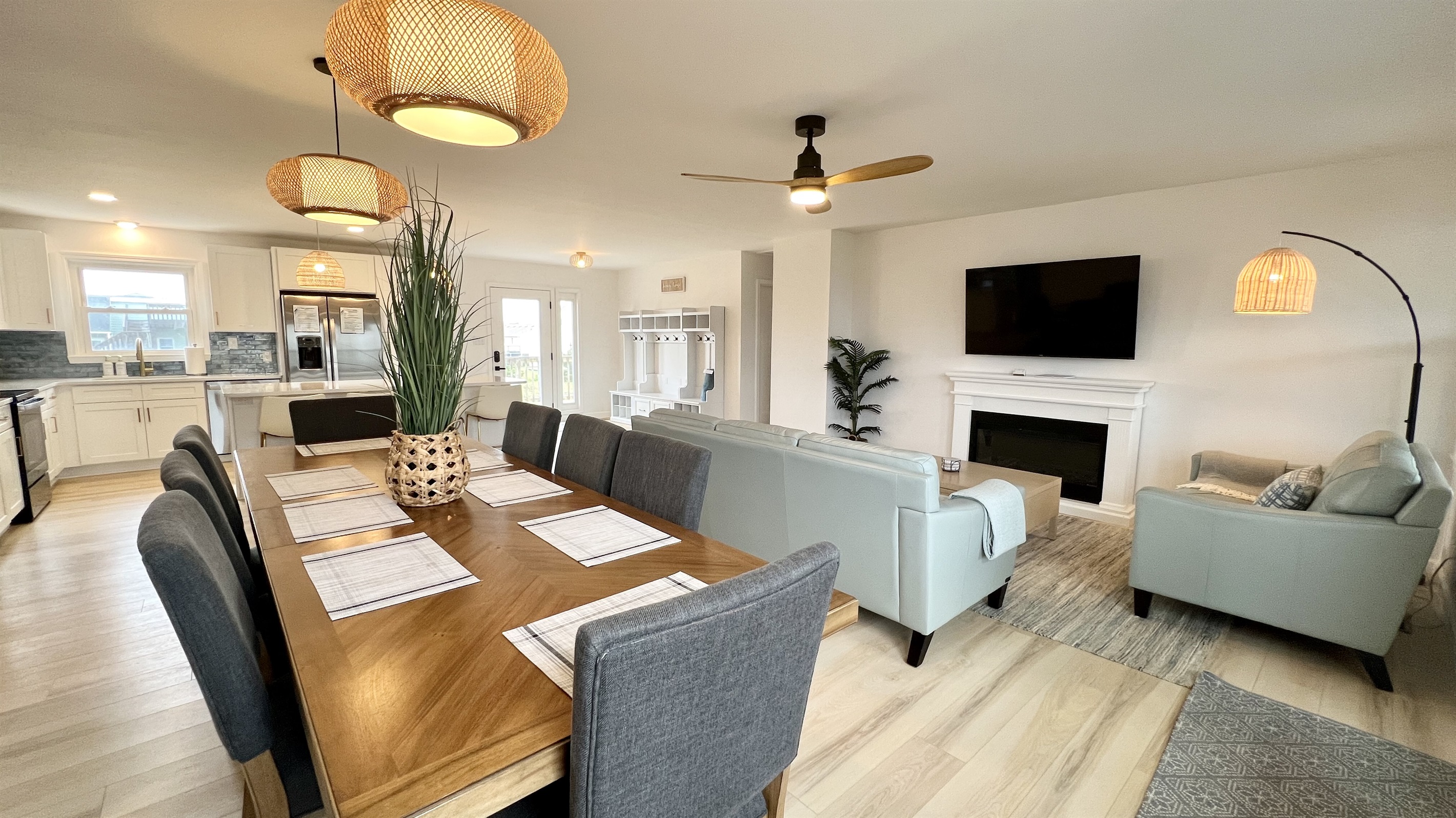 Open space gives views of the large smart TV and electric fireplace from anywhere.