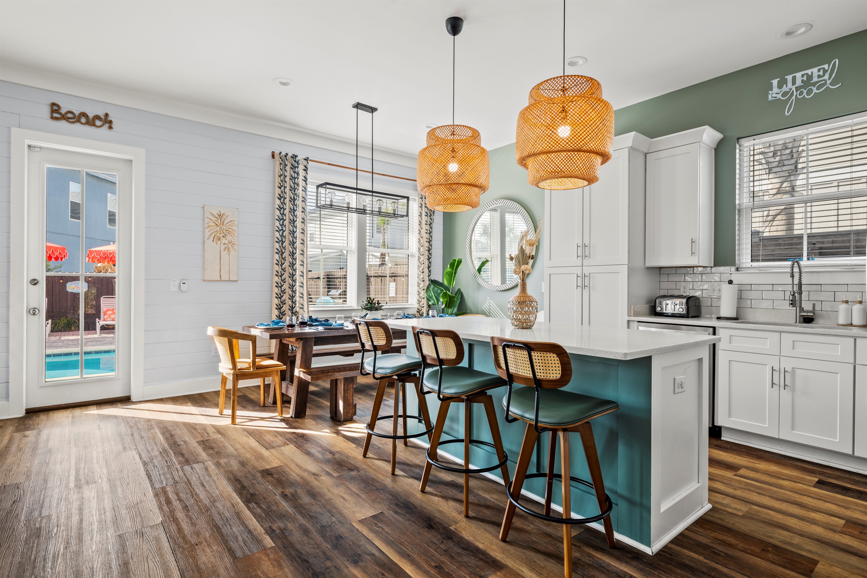 Morning coffee, quick snacks, and evening drinks all happen around this spacious kitchen island. The heart of the home during your Destin getaway.