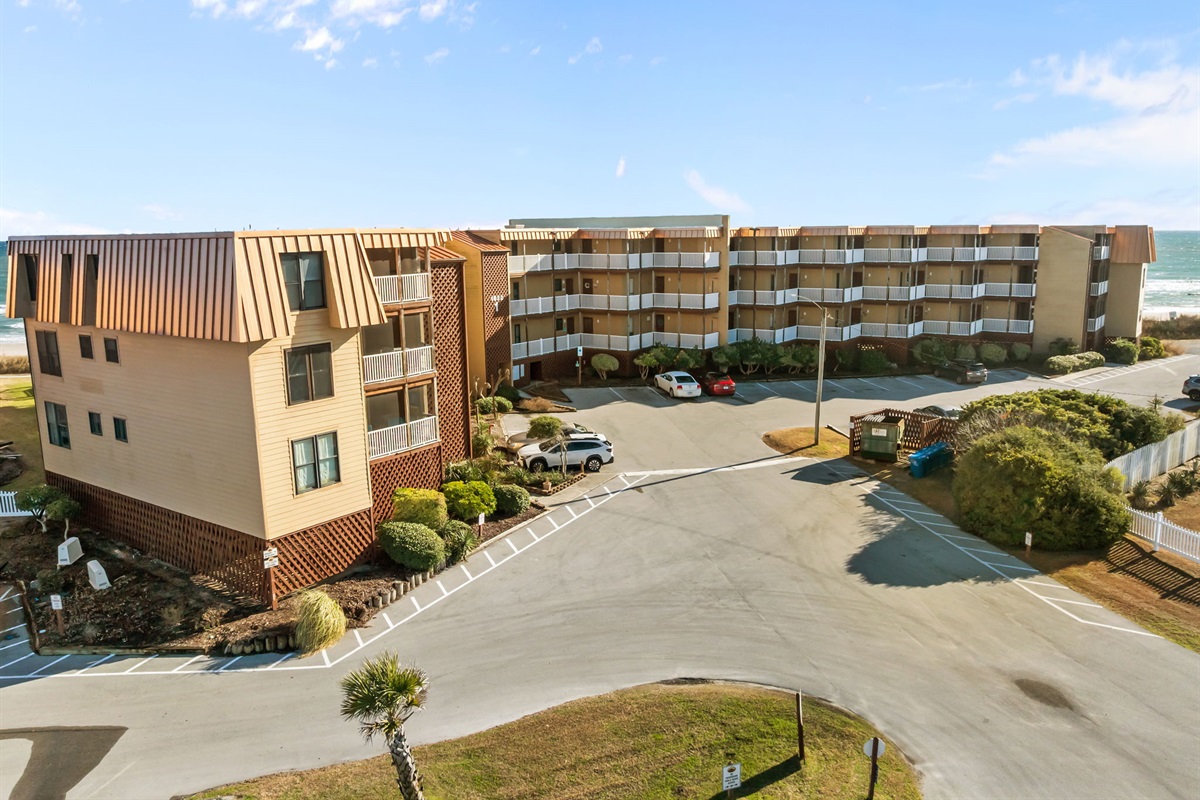 Topsail Dunes Building 1, featuring on-site parking and a prime location just steps from the beach