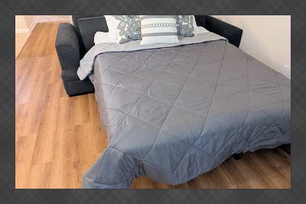 Sofa easily converts to a queen bed with all bedding provided. 