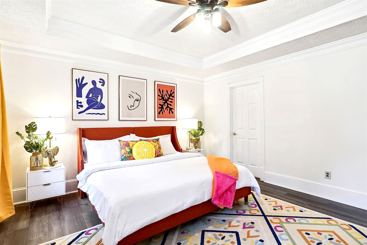 Bedroom 3 is located upstairs, a master bedroom featuring a king bed, TV, a private en-suite bathroom, and a dedicated desk space.