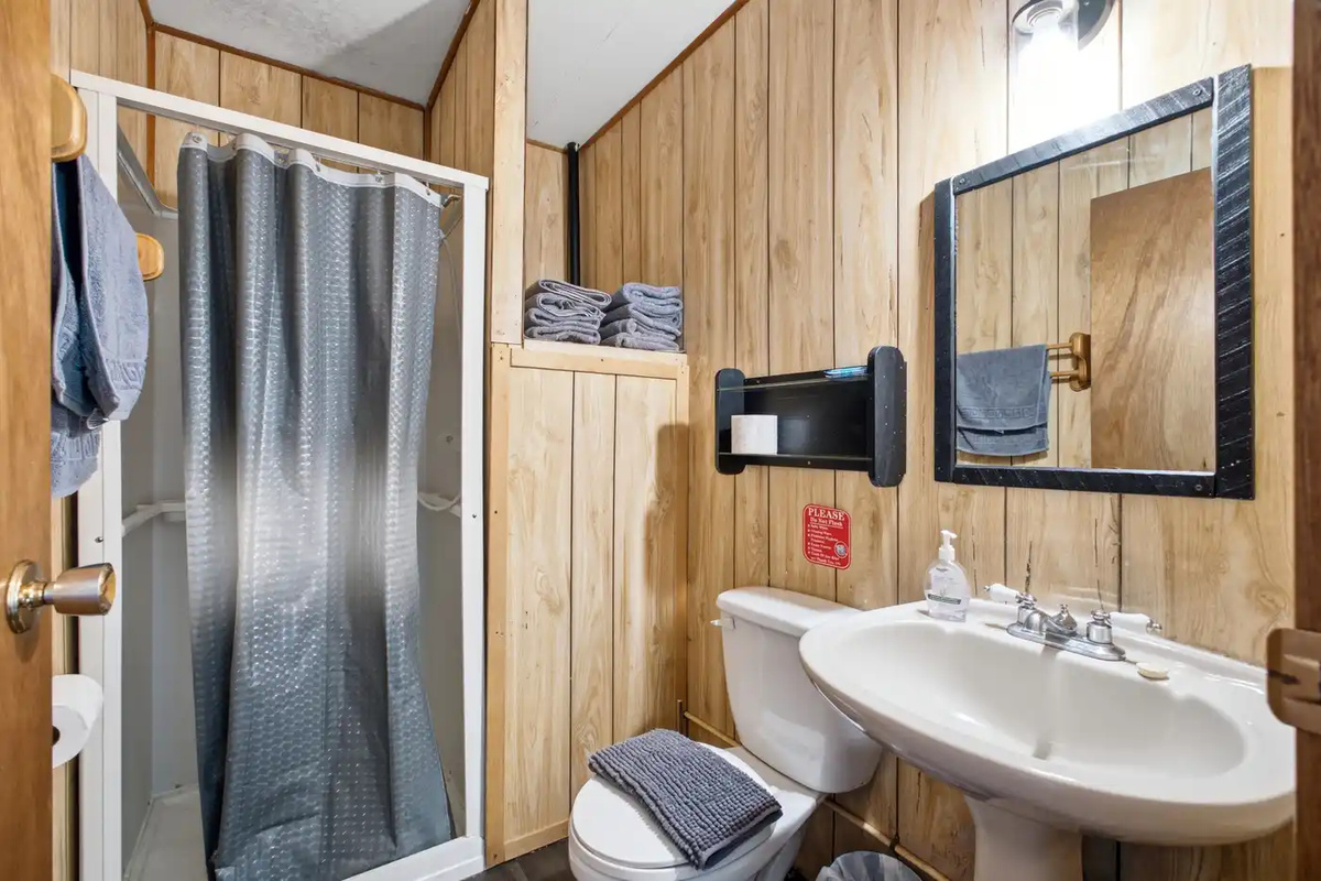 Bathroom with shower, vanity and practical storage