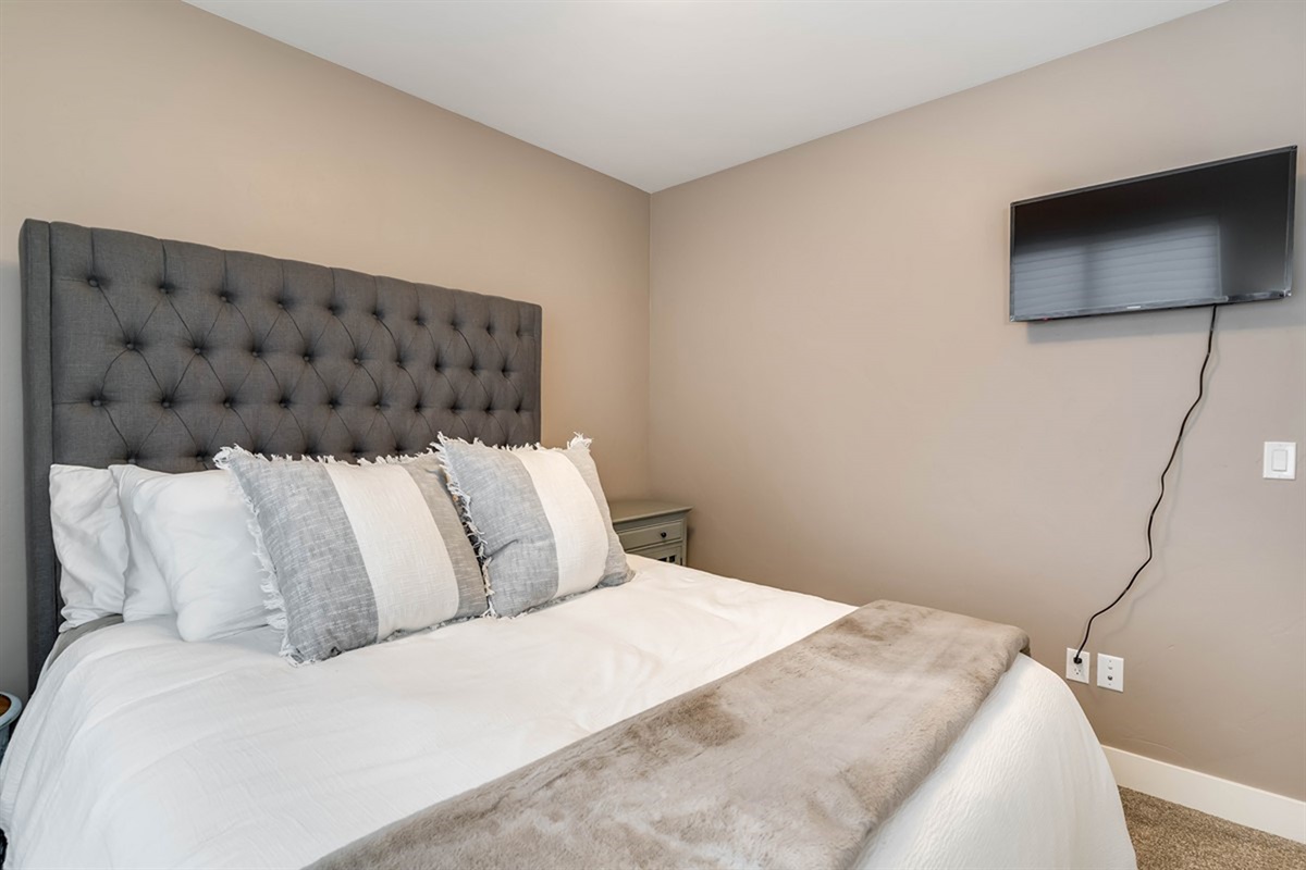 Cozy lower-level queen bedroom for restful nights