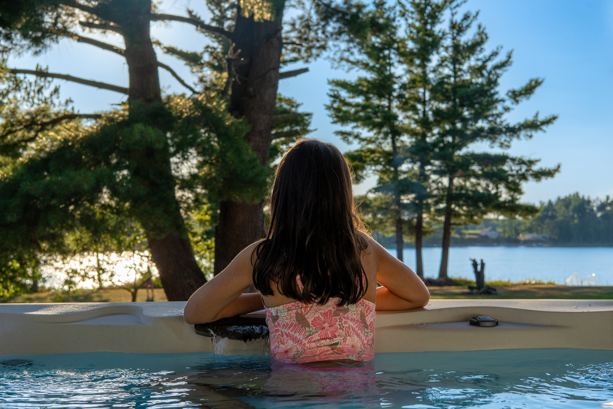 Soak up the view at your brand new 7-seat hot tub overlooking the lake