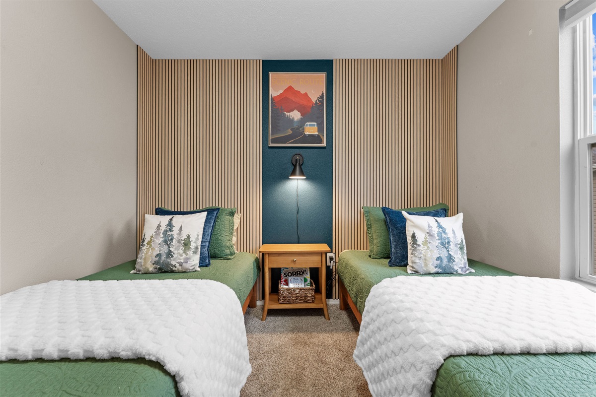 Twin bedroom with modern accent wall