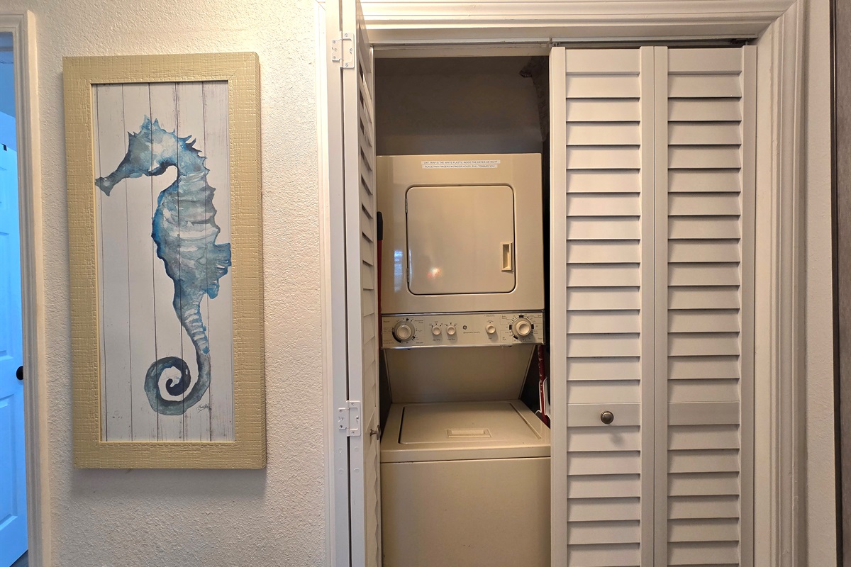 The washer & dryer are a small stacked set in the hall between your bathroom & bedroom.