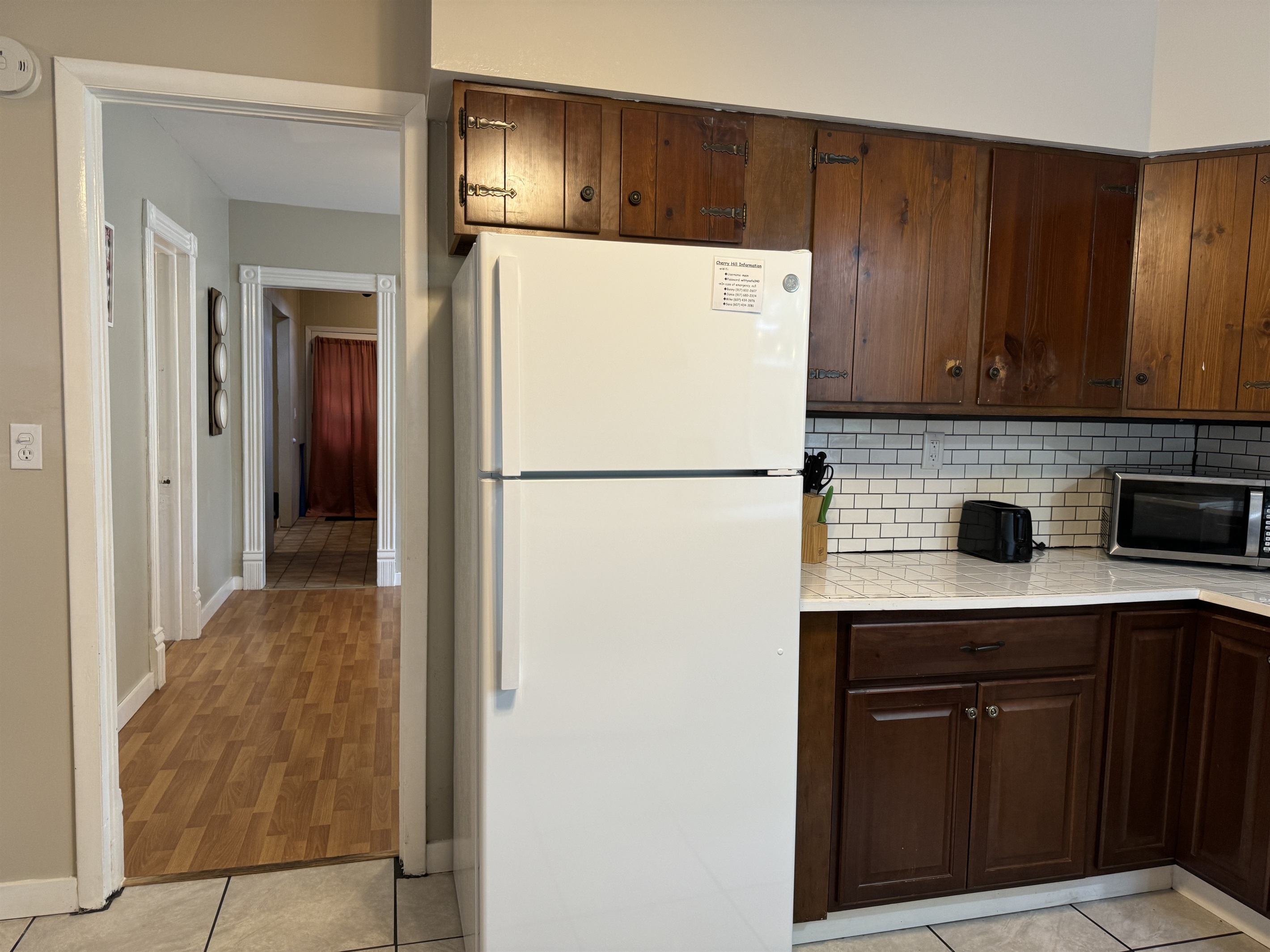 Kitchen with dining room and hallway beyond