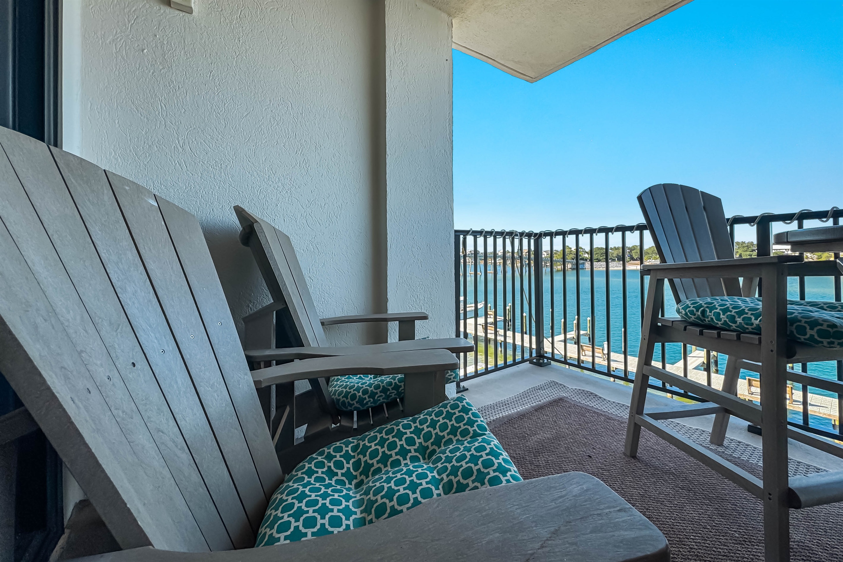Cherish moments of tranquility and sunshine from this beautiful, private patio overlooking the clear blue water. Where are you dreaming of traveling next?