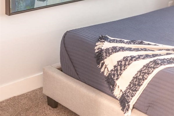 Decorative hanging frames, adding a personal and artistic touch to the room's decor.