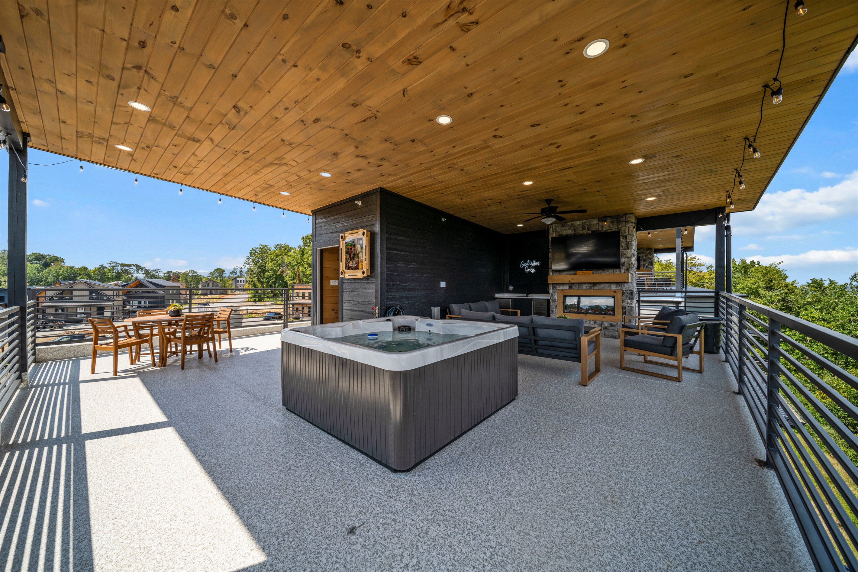 Private rooftop terrace with hot tub, fireplace, and breathtaking sunrise + mountain views.