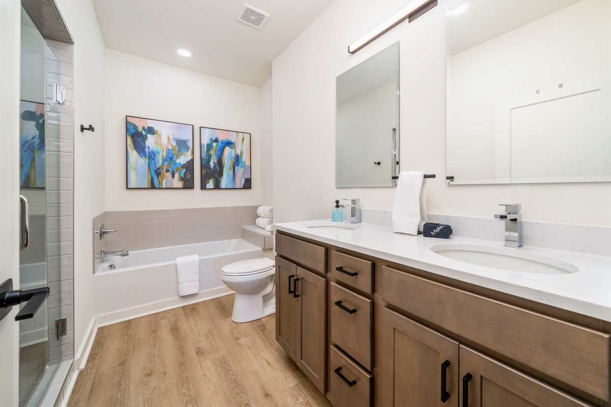 En-Suite Primary Bathroom with Double Sinks and Separate Tub/Shower