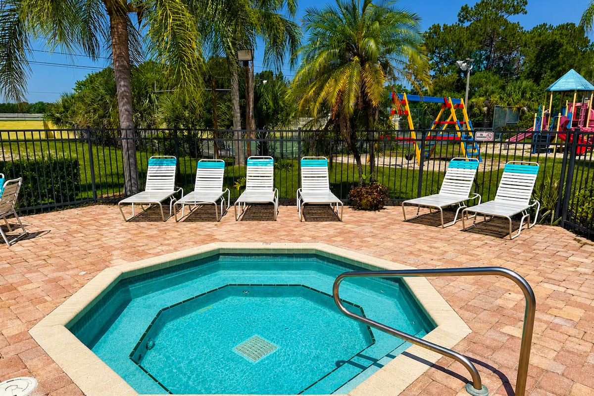 Relax in the community hot tub while children enjoy the nearby playground.