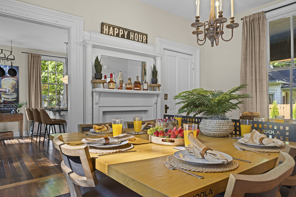 Brunch is served, with fresh fruit, orange juice, and a beautifully set table ready for the group's first morning together.