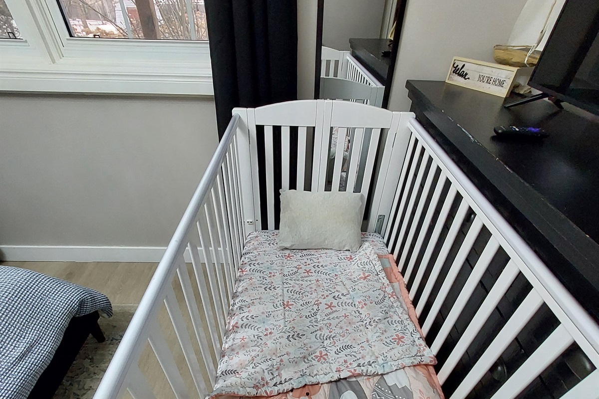 Full size crib with adjustable height can fit in any room. It is folded into a closet and can be requested to be set up if needed.