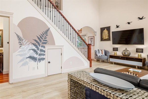The delicately hand painted mural illustrates the love and detail that went into the design of this modern waterfront retreat. Equally perfect for relaxation and  entertaining, vaulted ceilings and natural light complete your lovely beach getaway.