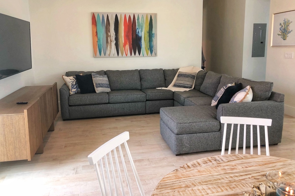 Living Room With Comfortable Seating And T.V. With Comcast Cable