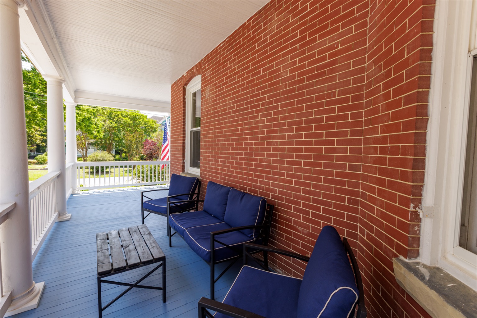 Large Wrap around porch with privacy around the corner if a guest is to stay in the other unit.