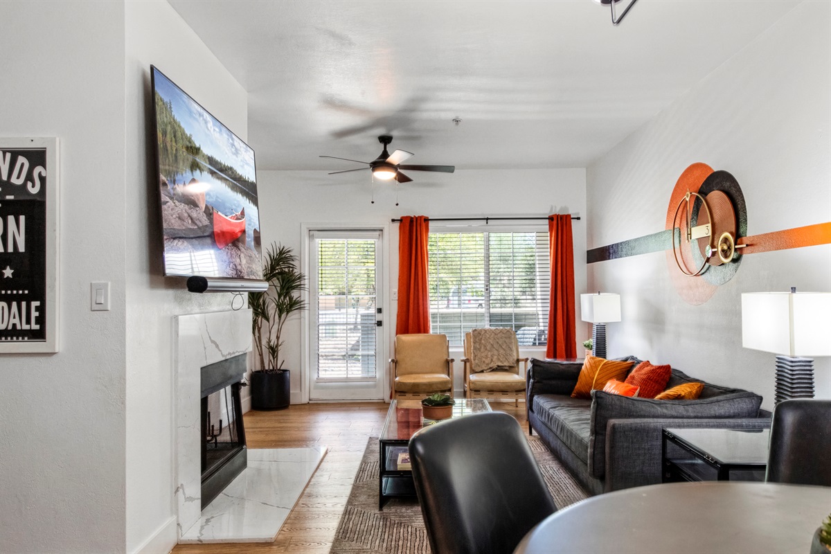 Modern and comfortable living room featuring a cozy sofa, large smart TV, and stylish décor designed for relaxation and entertainment.
