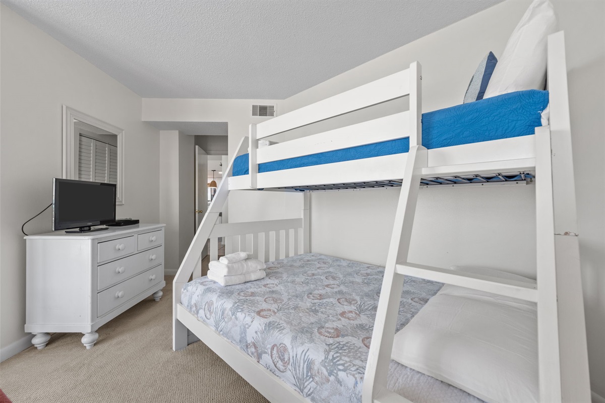 Comfortable sleeping space with TV and storage for a convenient stay