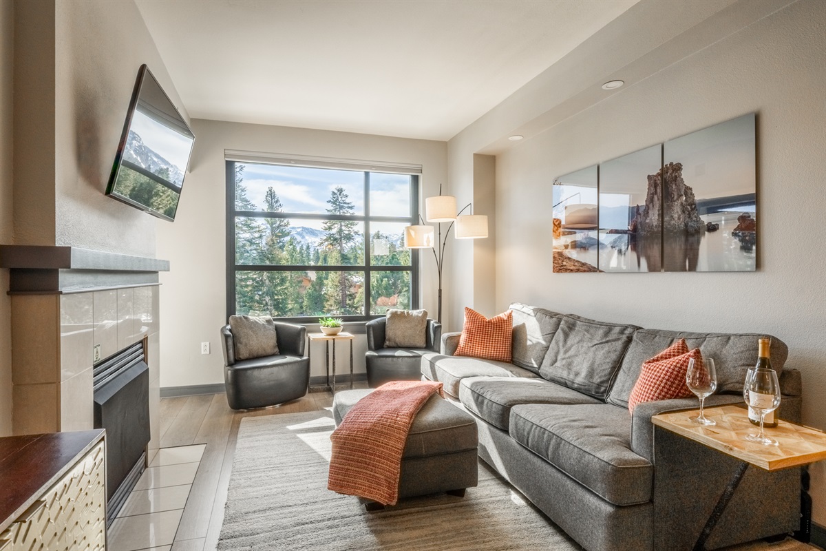 Two leather swivel chairs and a 3 person sleeper sofa create inviting lounge seating with room to unwind or settle in for the night.