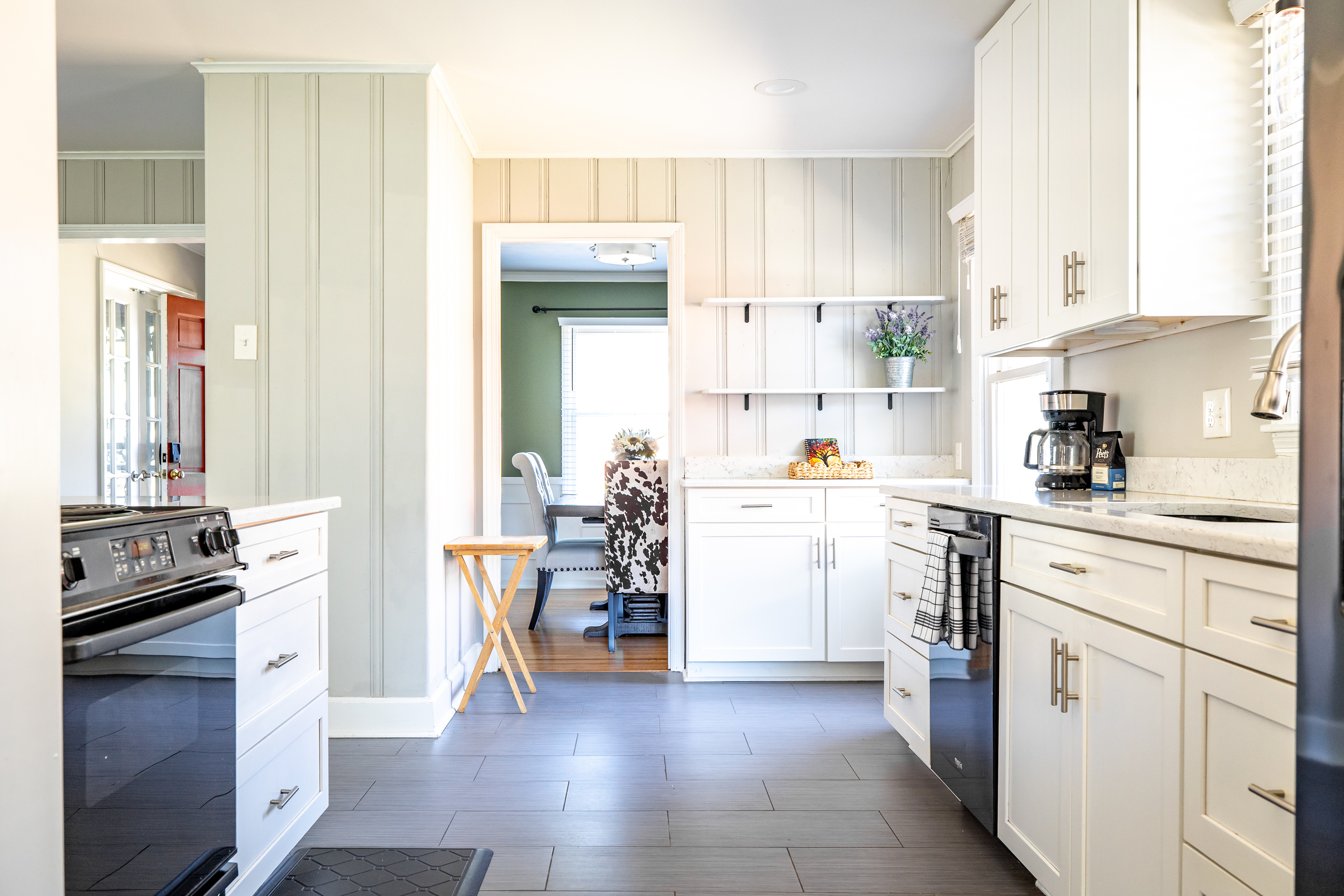 Fully equipped kitchen with refrigerator, stove, oven, microwave, dish washer.