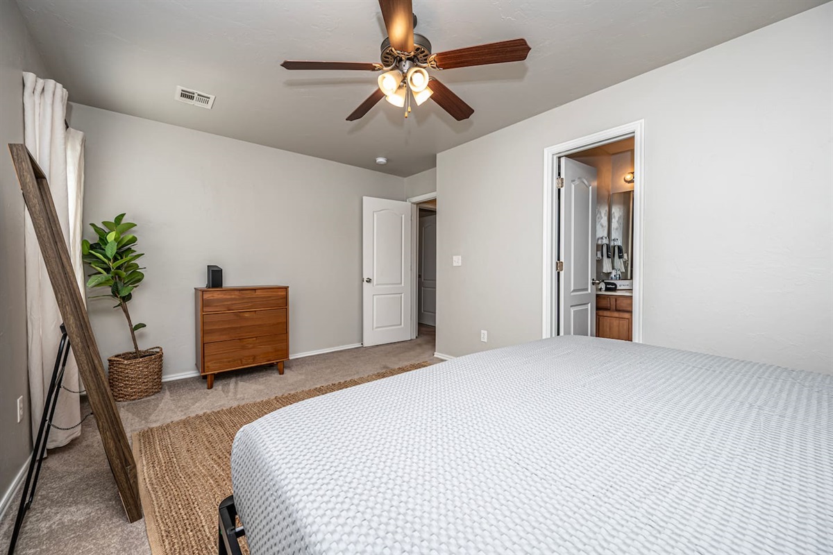 Your getaway starts here: master suite featuring a cozy king bed.