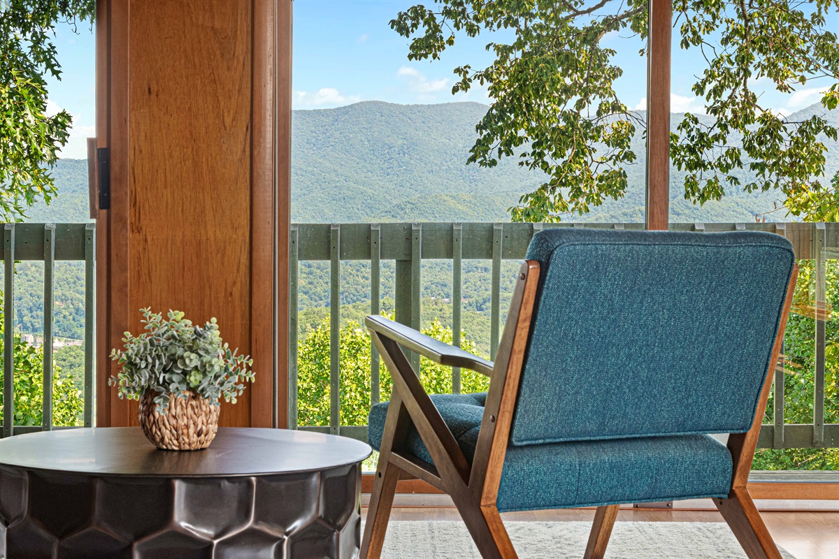 Enjoy breathtaking mountain views from your stylish armchair oasis!